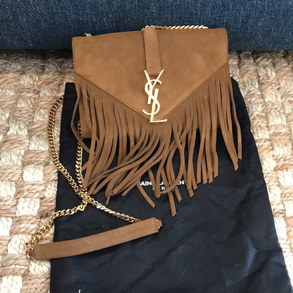 Saint Laurent suede fringe purse. Gold hardware.